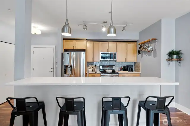 Shiny kitchen with stainless steel appliances.