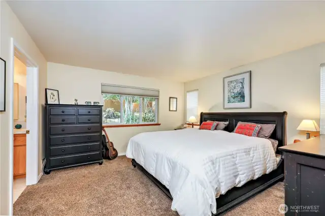 Large Primary bedroom... easily enough room for a large king size bed dresser. Ensuite bathroom to the left.