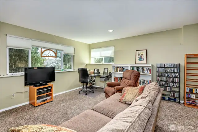 This is a grand room. It has enough sq. footage for large couch, office area and bedroom to the right.