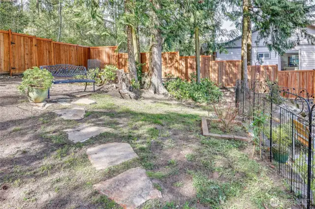 Fully fenced backyard with gate to upper right that leads to Cappy's trails.