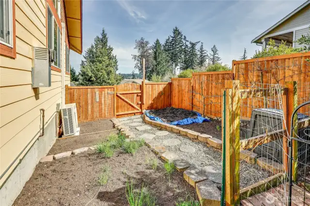 South side of the home has beds for a garden.