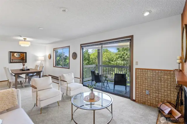 The living room opens seamlessly to the dining area off the kitchen and the covered deck, offering lots of options for dining and entertaining.