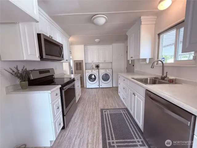 Updated kitchen with stainless steel appliances and like new washer and dryer.