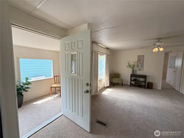 Front door opens to nice additional sunroom.