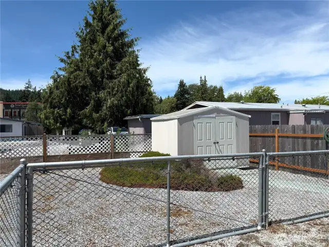 Oversized back yard is fully fenced with additional double door shed for all your tools!