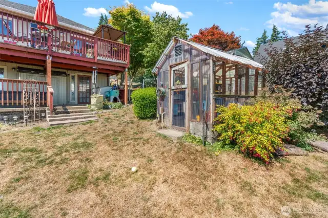 Greenhouse.  There is a fenced garden space not depicted in the photo's.