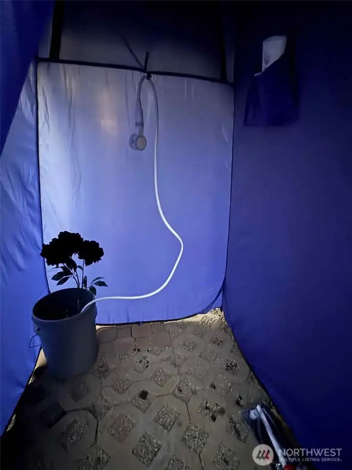 rechargeable water pump that uses water from the bucket through the shower hose which has an on and off switch!