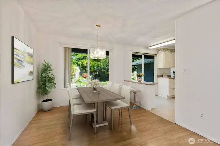 Dining room is off Living area and also looks into Kitchen. (Virtual staging used)