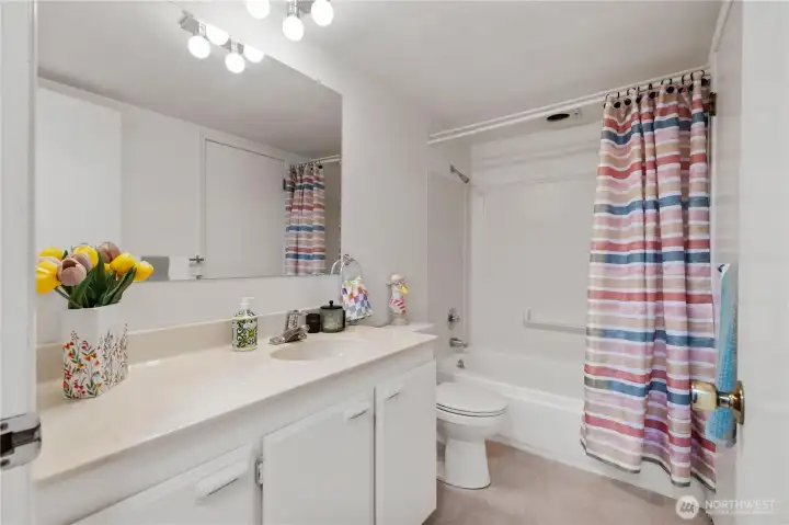 Hall bath with tub/shower combination.