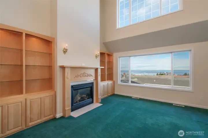 Living Room with built-in s and propane fireplace.