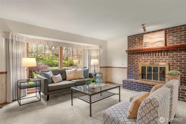 Living room w/bay window & wood burning fireplace