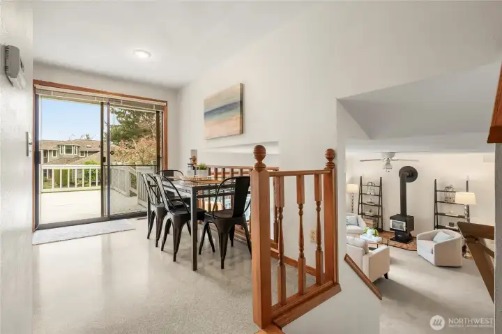 Eating nook w/slider to upper deck an stair access to lower level