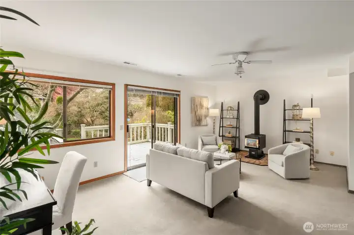 Rec room w/access to 2 car garage, 1/2 bath, laundry & slider to lower deck