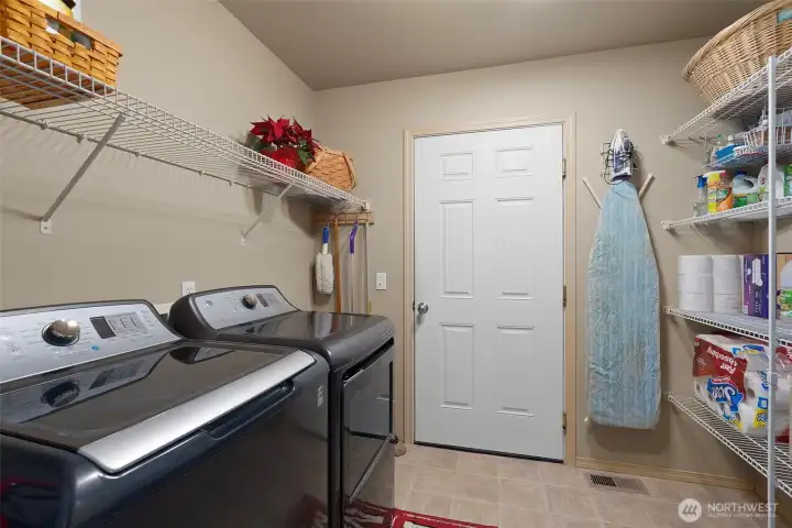 Laundry room. Door leads to large 3-car garage.