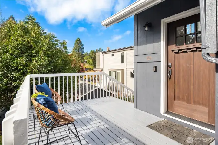 The main entrance is off this sunny deck with another entrance off the back parking space and a third off the walk-out basement.