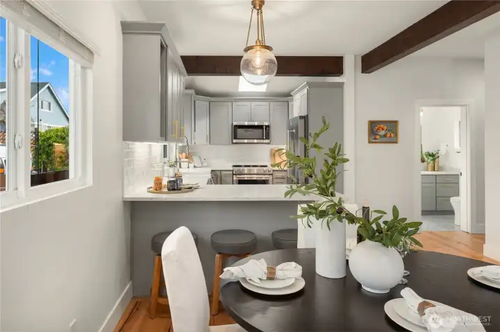 Just off the end of the updated kitchen is a breakfast bar that seats 3 comfortably.