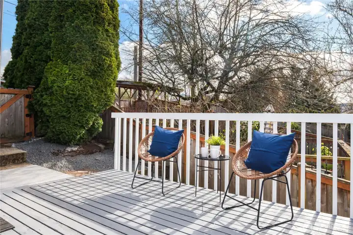 Just off the upper parking area is the side entrance and this sunny deck.