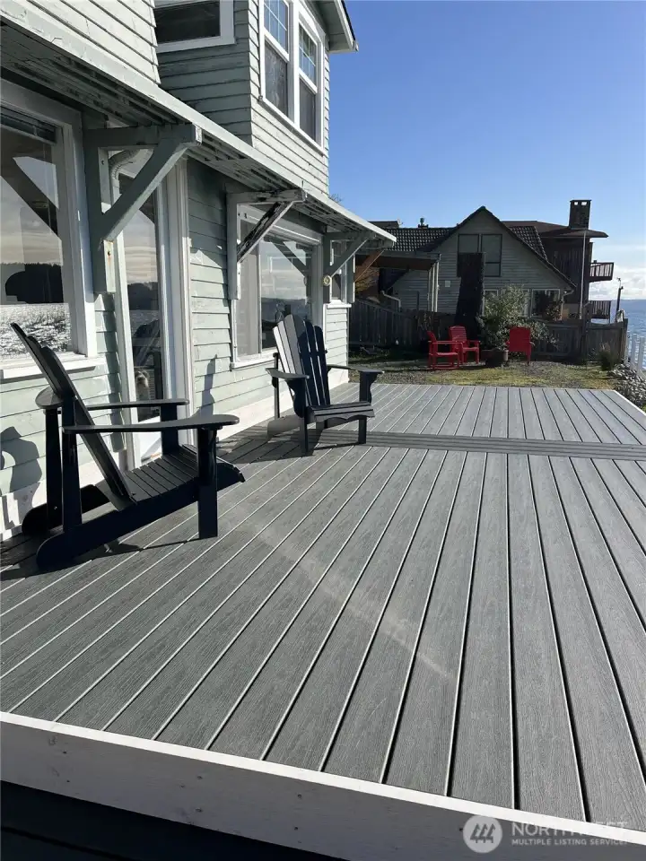 Brand new composite deck with plenty of space for a large dinner party and only feet away from the lapping water.
