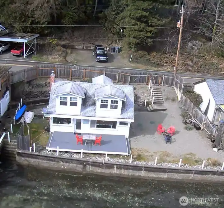 Arial view of the property across the street and parking.