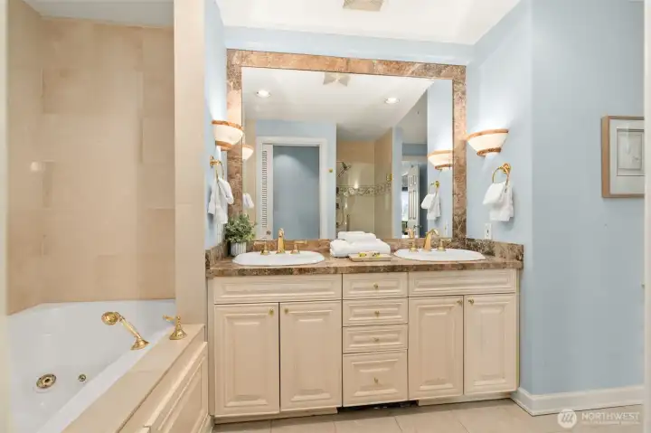 Double sinks, jetted tub & glass shower