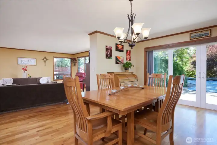 Dining area with sliding doors out to the patio & pool Dining area with sliding doors out to the patio & pool