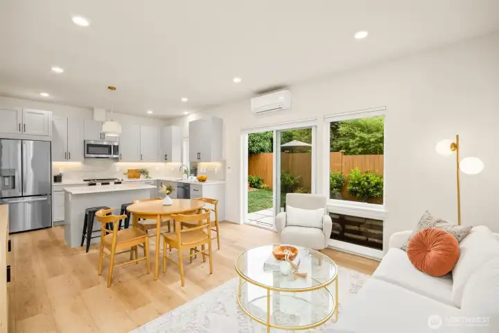 Open spacious layout with dining space, cooling mini-split and a large slider that leads to the private backyard.