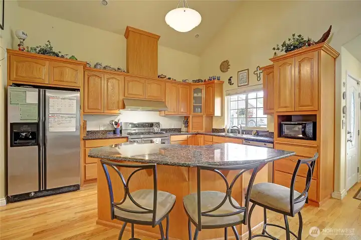 Enjoy cooking and entertaining in this open kitchen with eating space on the island.
