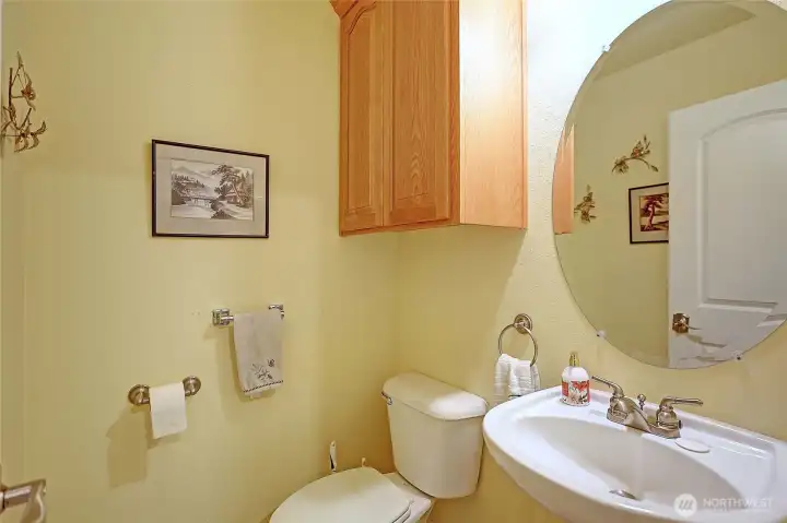 Half bath is located just off the kitchen.