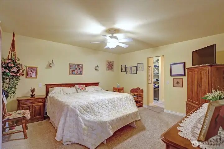 The primary bedroom located on the main level offers a one level living concept.