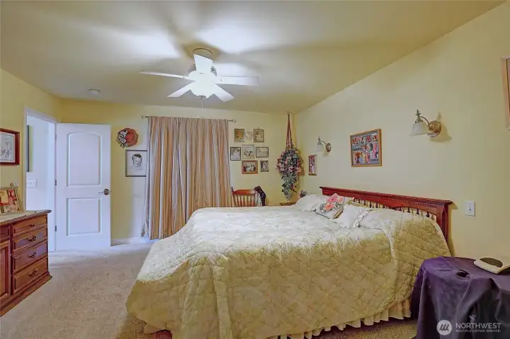 Large and spacious primary bedroom located just off the living room.