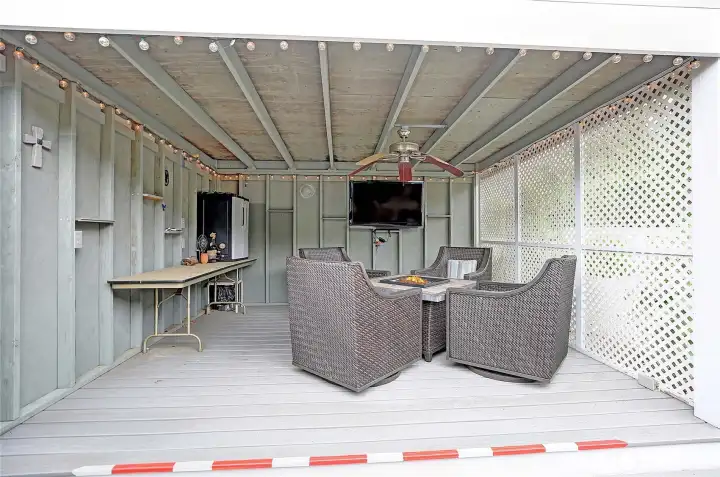 Enjoy the fire pit with outdoor TV year round under your covered gazebo