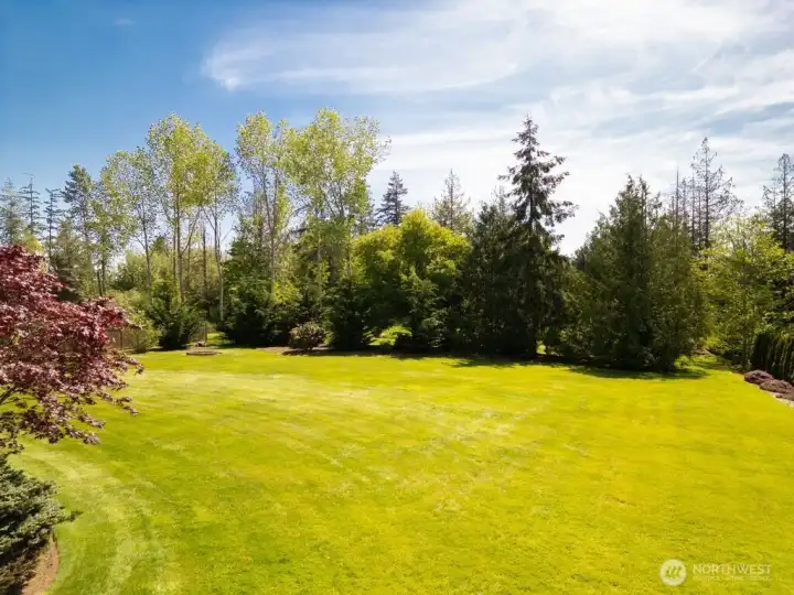 View of the expansive side yard. This photo was taken in May before New drainfield was installed in June with Hydroseeding done on July 1st. View of the expansive side yard. This photo was taken in May before New drainfield was installed in June with Hydroseeding done on July 1st.