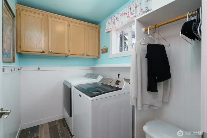 Upstairs laundry room with tile floor. Upstairs laundry room with tile floor.