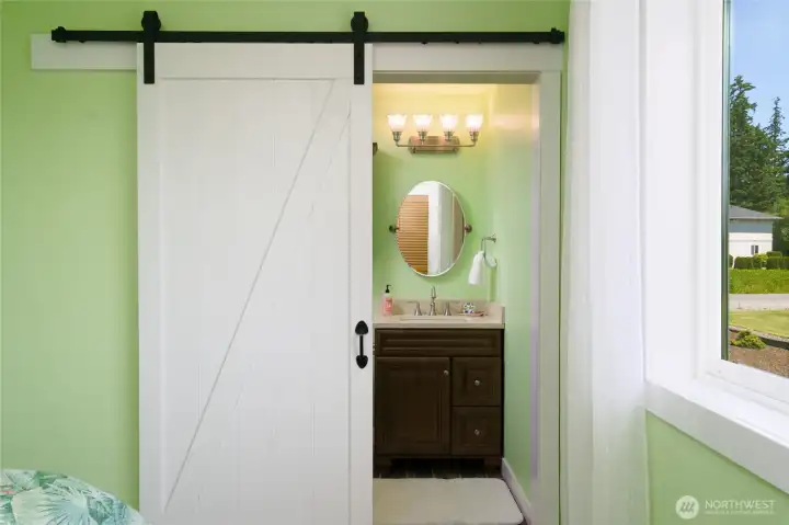 Barn door to ensuite 3/4 bath in bedroom # 2 Barn door to ensuite 3/4 bath in bedroom # 2