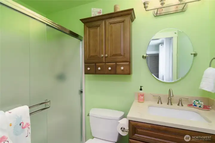 3/4 bath in Bedroom # 2 refreshed in 2017 with quartz countertop, cabinetry, tile floor, toilets and lighting. 3/4 bath in Bedroom # 2 refreshed in 2017 with quartz countertop, cabinetry, tile floor, toilets and lighting.