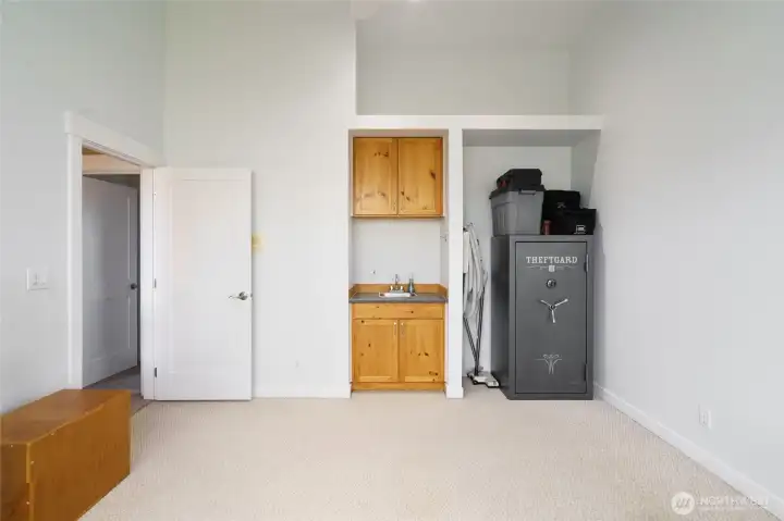 The other half of the bonus room with wet bar and safe. ( Safe to remain if buyer wants it) The other half of the bonus room with wet bar and safe. ( Safe to remain if buyer wants it)