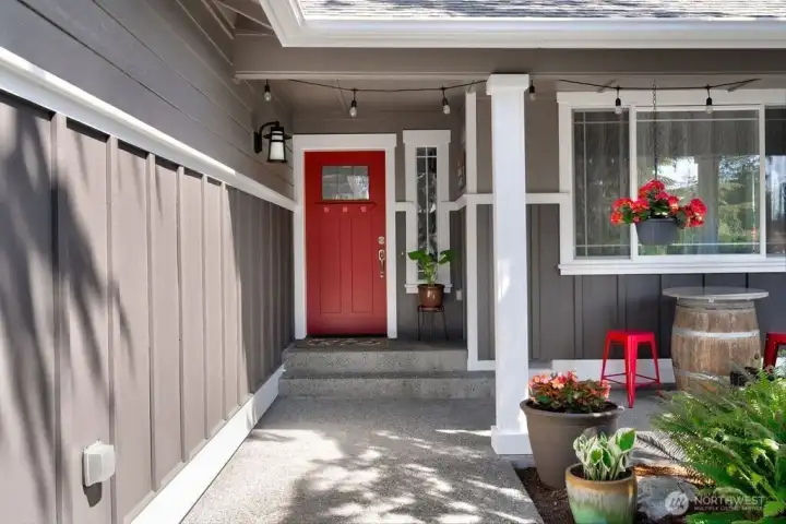 Front entrance to the home with covered front porch. Siding installed in 2015 with new door. Home has been freshly painted in 2025. Front entrance to the home with covered front porch. Siding installed in 2015 with new door. Home has been freshly painted in 2025.