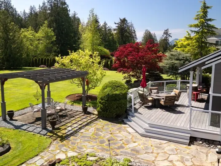 View of the side deck, gazebo and expansive yard. New drainfield was installed in June so section of the yard has been hydroseeded. This photo was taken in May before the new drainfield was installed. View of the side deck, gazebo and expansive yard. New drainfield was installed in June so section of the yard has been hydroseeded. This photo was taken in May before the new drainfield was installed.