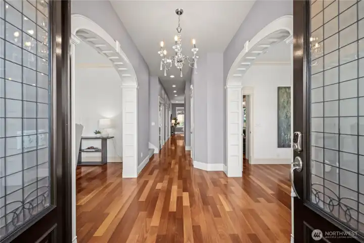 Step inside to an elegant formal living room with a fireplace and a sophisticated formal dining room, creating a warm and inviting first impression.