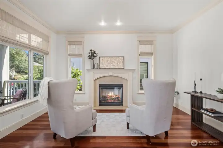 Enjoy a quiet afternoon by the fireplace in the formal living room while watching the kids play on the front porch.
