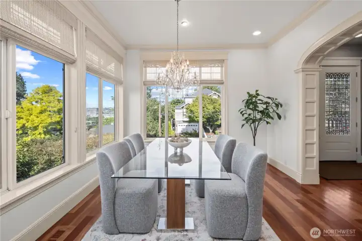 Every meal becomes a special occasion with sweeping views of Salmon Bay, Ballard, and the Seattle skyline woven into the experience of this beautiful home.