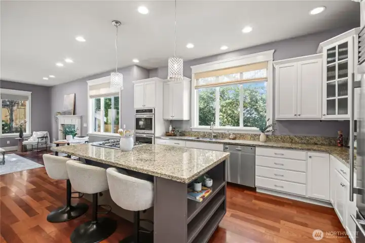 The open-concept kitchen seamlessly connects to the spacious living room and extends to the backyard, creating an ideal flow for everyday living and entertaining.