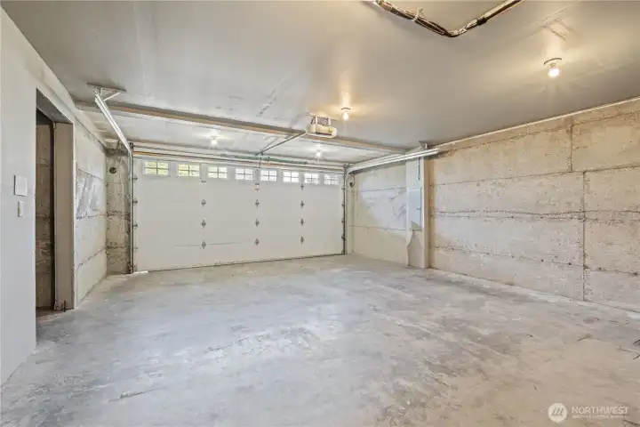 Generous two-car garage with a dedicated storage nook.