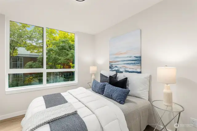 Wake up surrounded by lush greenery and natural light. This bedroom offers a peaceful escape, perfect for restful nights and refreshing mornings.