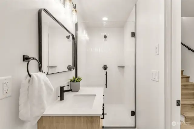 Step into luxury with this sleek, glass-enclosed shower. Designed with comfort and style in mind, it’s a refreshing way to start or end your day.