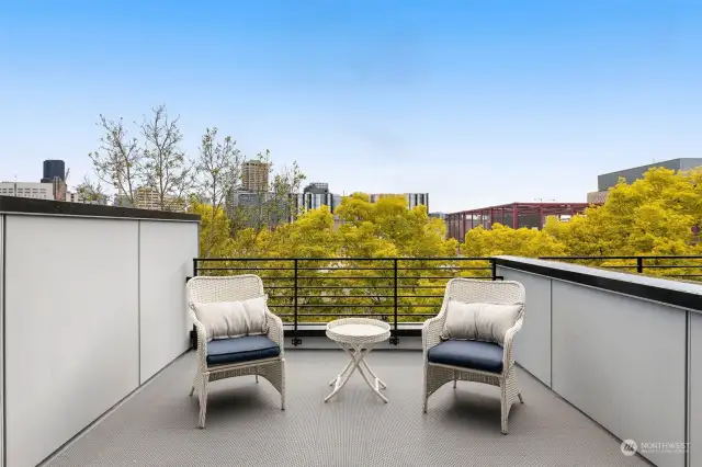 Enjoy peaceful moments and skyline views on your private rooftop deck. Perfect for morning coffee or evening relaxation.