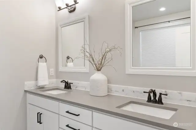 Primary Bathroom equipped with double vanity & quartz counters