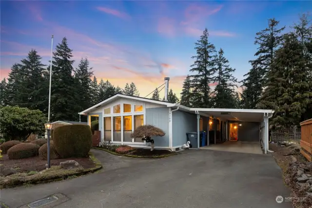 Your new home has terrific curb appeal, and the interior gets even better! Covered parking, a shop/storage building, expansive deck, even a hot tub. It's wired for generator, has a step-in jetted tub; the list goes on and on!