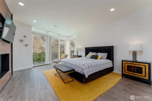 Primary bedroom with deck, river view, overlooks pool, large walk in closet, spacious bath