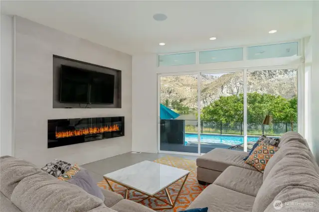 Main floor living area with slider to pool